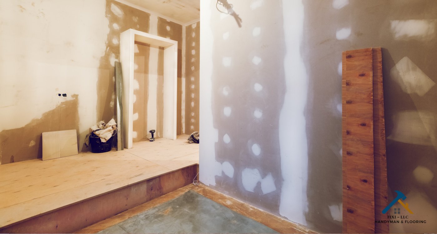 Utah County Woman Owned Drywall Repair Company Interior view of a room undergoing drywall repair with visible patchwork and joint taping, highlighting drywall finishing services in Utah County by FIXI LLC...