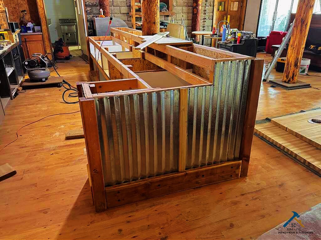Custom Carpentry for Businesses in Utah by FIXI LLC Custom carpentry project in Utah County, showcasing skilled woodwork and detailed craftsmanship by FIXI LLC. The image features a workbench, wooden materials, and tools for creating custom wood pieces. Perfect for homeowners looking to enhance their space with personalized wood designs...